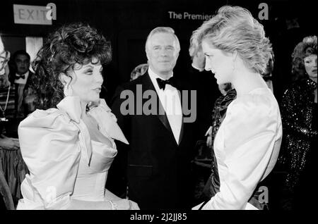 HRH Princess Diana, The Princess of Wales (right) meets actor Joan Collins at the Film Premiere of '84 Charing Cross Road' in aid of the Cinema and Television Benevolent Fund. The film stars Anne Bancroft, Anthony Hopkins and Judi Dench.  George Peppard, actor, stands centre of the picture, bow tie, and to Joan Collins's left.  Picture taken 23rd March 1987