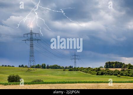 On the sultry, hot summer day, looming storm clouds appear in the sky on the upper Au area near the small town of Trossingen. Stock Photo