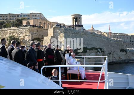 Pope Francis sits aboard a ferryboat leaving Valletta�s port, en route