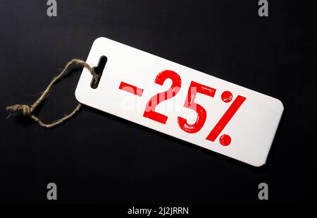 Sticker on the counter -25 discount on goods. Stock Photo