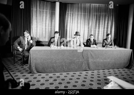 Left to right, Frank Pressland (Lawyer), Paul White (From Hanover Drew), Elton John, John Reid (Elton's manager) and Eddie Plumley (MD of Watford). Pictured during a press statement about Elton John's £2 Million sale of Watford FC. 8th December 1987. Stock Photo