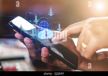 download,Closeup hand of woman with Cloud download on mobile smartphone Stock Photo