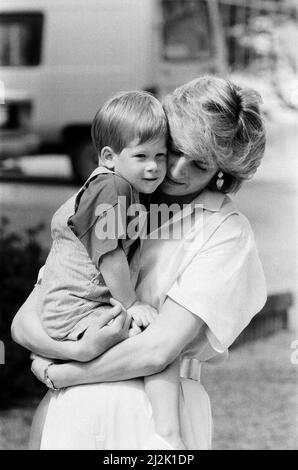 HRH Princess Diana, The Princess of Wales holds her young son Prince Harry on holiday in Majorca, Spain. Picture taken 9th August 1987. Stock Photo