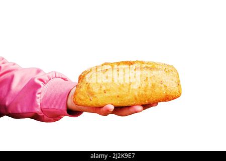 Bread in the hand of a middle-aged woman. The concept of the world food crisis associated with the war in Ukraine. Isolated on white background. Stock Photo