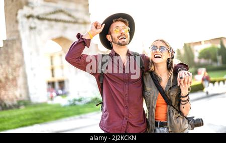 Happy boyfriend and girlfriend in love having genuine fun walking at old city center - Wanderlust life style and travel vacation concept Stock Photo