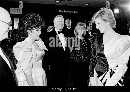 HRH Princess Diana, The Princess of Wales (right) meets actor Joan Collins at the Film Premiere of '84 Charing Cross Road' in aid of the Cinema and Television Benevolent Fund. The film stars Anne Bancroft, Anthony Hopkins and Judi Dench.  George Peppard, actor, stands centre of the picture, bow tie, and to Joan Collins's left.  To George's left is Jane Asher.  Picture taken 23rd March 1987