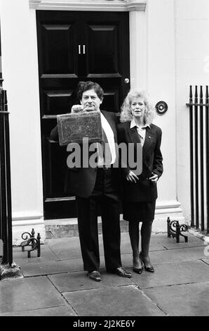 The Chancellor of the Exchequer, Nigel Lawson, and his wife Therese. Pictured on Budget Day, leaving Downing Street for the House of Commons. London. 15th March 1988. Stock Photo