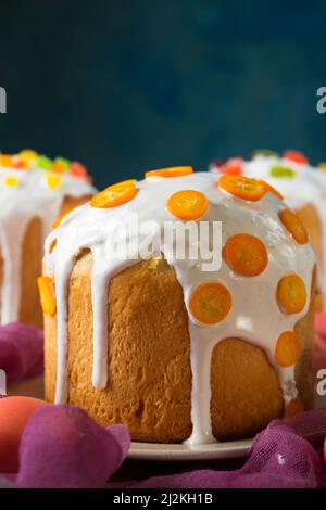 Easter cakes decorated with candied fruits and jelly sweets and kumquat Stock Photo
