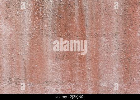Old reddish brown dirty rough weathered texture concrete wall surface cement worn background. Stock Photo