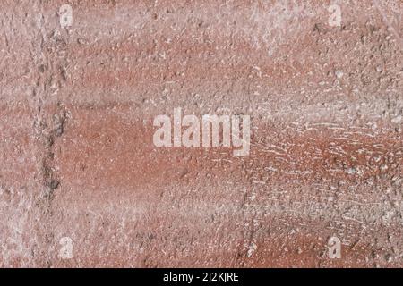 Old reddish brown dirty rough weathered texture concrete wall surface cement worn background. Stock Photo