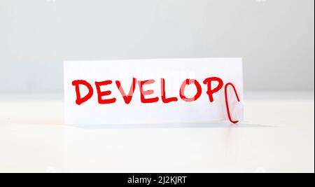Develop word written on wood block. Develop text on cement table for your desing, concept Stock Photo