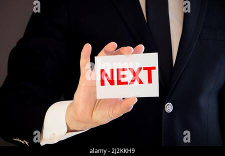 Better Life Sign on white paper. Man Hand Holding Paper with text. Isolated  on sky background Stock Photo - Alamy