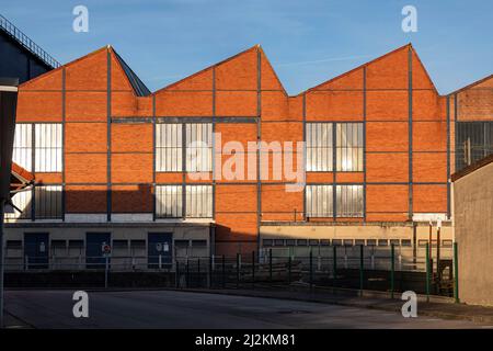 Vintage red brick industrial factory warehouse in the city of Cherbourg, France Stock Photo
