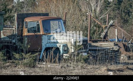 Abandoned old rusty agricultural machinery and equipment on the farm Stock Photo