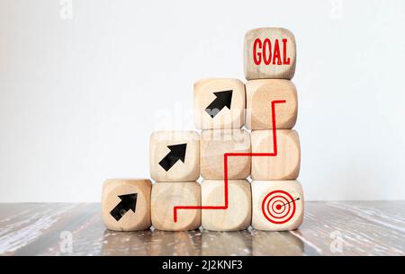 Pieces of wood, cubes and light box with message goal and hope 2021 on wooden background Stock Photo