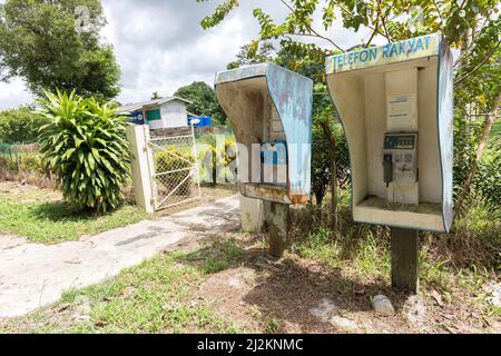 Public telephones in rural outdoor setting, Mulu, Malaysia Stock Photo