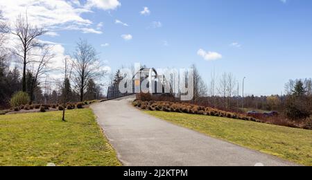 Pedestrian bridge across Trans Canada Highway in modern city suburbs Stock Photo