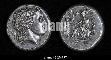 Ancient coin with Alexander the Great portrait and Athena, inscription King Lysimachus on Greek. Silver tetradrachm coin, old rare money, 290 BC. Conc Stock Photo