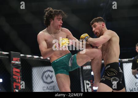 MANCHESTER, UK. APR 2ND Luke Riley knees Jack Eglin during the Cage Warriors 136 event at the BEC Arena, Manchester on Saturday 2nd April 2022. (Credit: Pat Scaasi | MI News) Credit: MI News & Sport /Alamy Live News Stock Photo