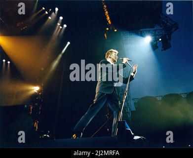 David Bowie performs at Maine Road, Manchester City Football Club Stadium, Manchester, as part of his Sound and Vision Tour.. Set list for this show was.  Space Oddity Rebel Rebel Ashes to Ashes Fashion Life on Mars? Sound and Vision Blue Jean Let's Dance Stay Ziggy Stardust China Girl (Iggy Pop cover) Station to Station Young Americans Suffragette City Fame 'Heroes' Encore: The Jean Genie Gloria Modern Love  Picture taken 7th August 1990 Stock Photo