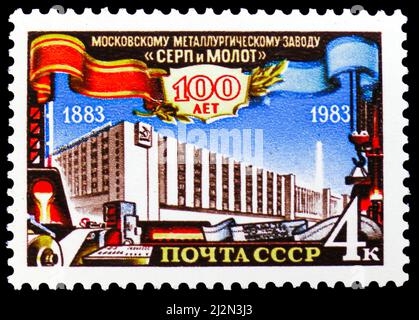 MOSCOW, RUSSIA - MARCH 13, 2022: Postage stamp printed in Soviet Union devoted to Centenary of the 'Hammer and Sickle' Steel Mill, Moscow, Anniversari Stock Photo