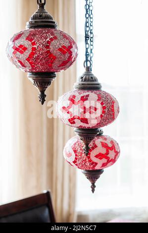 Traditional bright decorative hanging Turkish lights and colourful light lamps with vivid colours Stock Photo