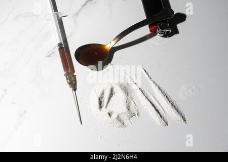 Drugs of various kinds and human skulls on the floor, Collection of different hard drugs Heroin Stock Photo