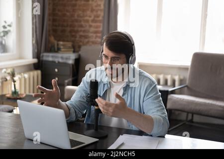 Serious engaged business professional man speaking at online conference Stock Photo