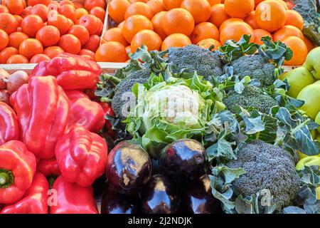 Vegetables and oranges for sale at a market Stock Photo