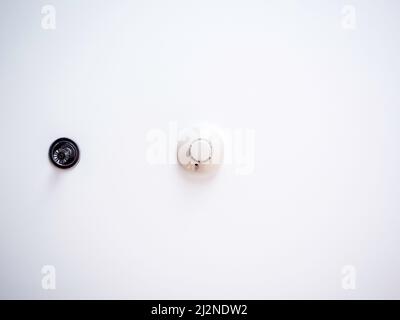 Smoke detectors sensor, automatic fire alarm extinguishing systems on white ceiling background with copy space near the water sprinkler, below view. P Stock Photo