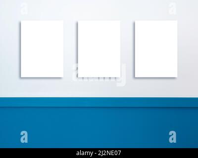 Three mockup empty blank white vertical rectangle border frame with same size hanging on the white and blue wall background . Mock-up poster, picture, Stock Photo