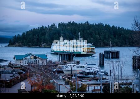 Friday Harbor, WA USA - circa November 2021: View of the Tillikum Washington State Ferry docking on San Juan Island, about to unload its passengers at Stock Photo