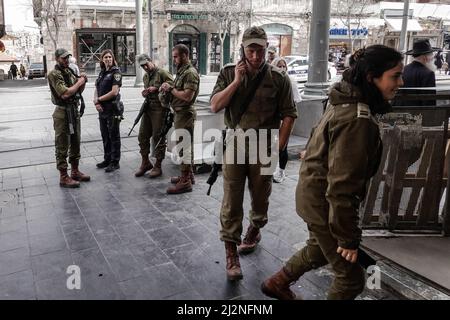 Jerusalem, Israel. 3rd Apr, 2022. IDF soldiers patrol the streets at the Shuk Mahane Yehuda Market reinforcing the Israel Police in crowded urban settings during the Muslim month of Ramadan. In just the past two weeks a spike in Arab terror attacks in Israeli cities and in the West Bank has injured 20 and claimed the lives of 11, elevating security measures in what the IDF titles Operation Wave Breaker. Credit: Nir Alon/Alamy Live News Stock Photo