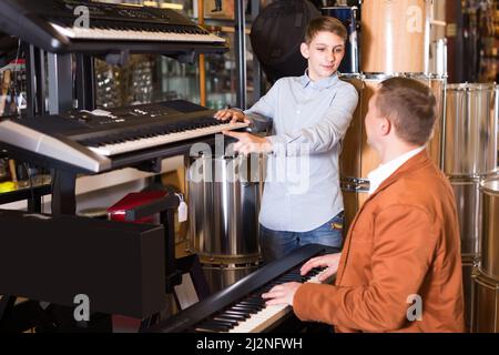 Customers are considering keyboard options Stock Photo