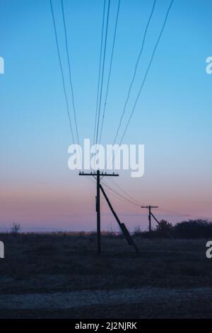 Colorful sunrise over the with trees and electric pole Stock Photo - Alamy