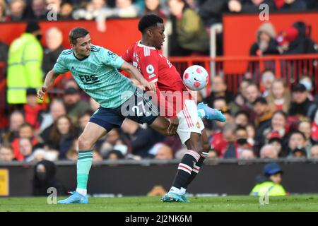 Leicester City's Timothy Castagne and Manchester United's Anthony Elanga during the Premier League match at Old Trafford, Greater Manchester, UK. Picture date: Saturday April 2, 2022. Photo credit should read: Anthony Devlin Stock Photo