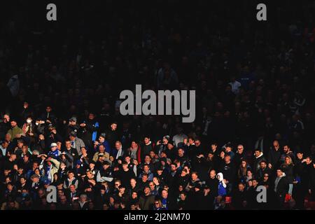 Leicester City fans in the bright sunshine during the Premier League match at Old Trafford, Greater Manchester, UK. Picture date: Saturday April 2, 2022. Photo credit should read: Anthony Devlin Stock Photo