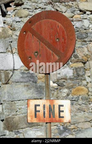 rusted road sign with the text FIN that means THE END in italian language Stock Photo