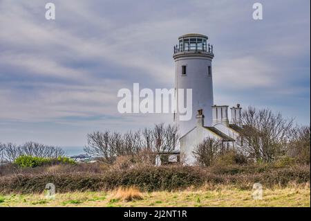 Portland Bill lower lighthouse is a disused 25metres high lighthouse located on the Isle of Portland near the coastal resort town of Weymouth Stock Photo