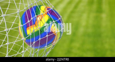 Rainbow color soccer ball in goal net, blur grass field background, close up view. LGBT colors ball, Gay football sport event, copy space. 3d render Stock Photo