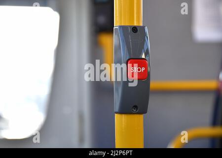 Close-up view of a push button inside a bus to signal to the driver to stop at the next bus stop. No people. Copy space. Stock Photo