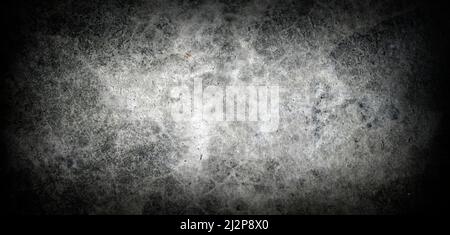 a black concrete background with a vignette is suitable for a horror concept or a gloomy news advertisement. Stock Photo