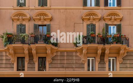 A picture of picturesque balconies on the facade of an apartment building in Rome. Stock Photo