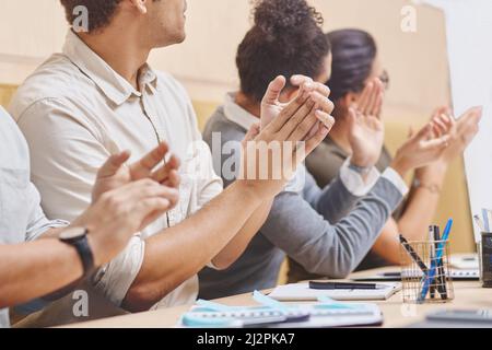 Now THAT is worthy of applause. Cropped shot of a group of unrecognizable businesspeople applauding during a meeting in the boardroom. Stock Photo