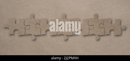 Top view flat lay of craft paper jigsaw puzzle game texture incomplete or missing piece, quiz calculation concept Stock Photo