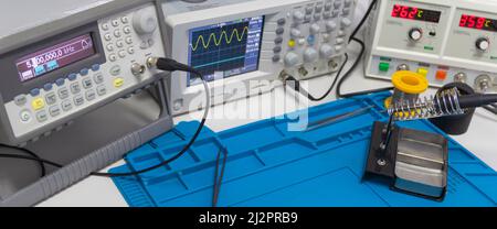 Power supplies and electronic measuring devices in the laboratory.Electronic measuring instruments in science lab. Stock Photo