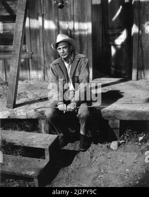 GARY COOPER on set candid during filming of his last screen appearance as narrator of the TV Documentary THE REAL WEST aired March 29th 1961 director / producer DONALD B. HYATT music Robert Russell Bennett National Broadcasting Company (NBC) Stock Photo