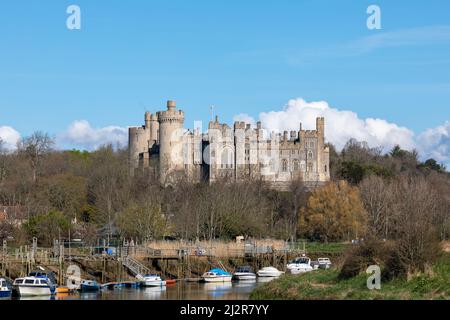 View of the West Sussex market town of Arundel. South side of the castle illuminated by the Spring sunshine. Stock Photo