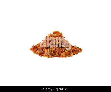 dried carrot pieces heap isolated on white background. Spices and food ingredients. Stock Photo