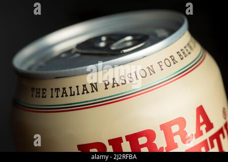 The Italian Passion For Brewing text on Birra Moretti Italian beer can close up detail on black Stock Photo